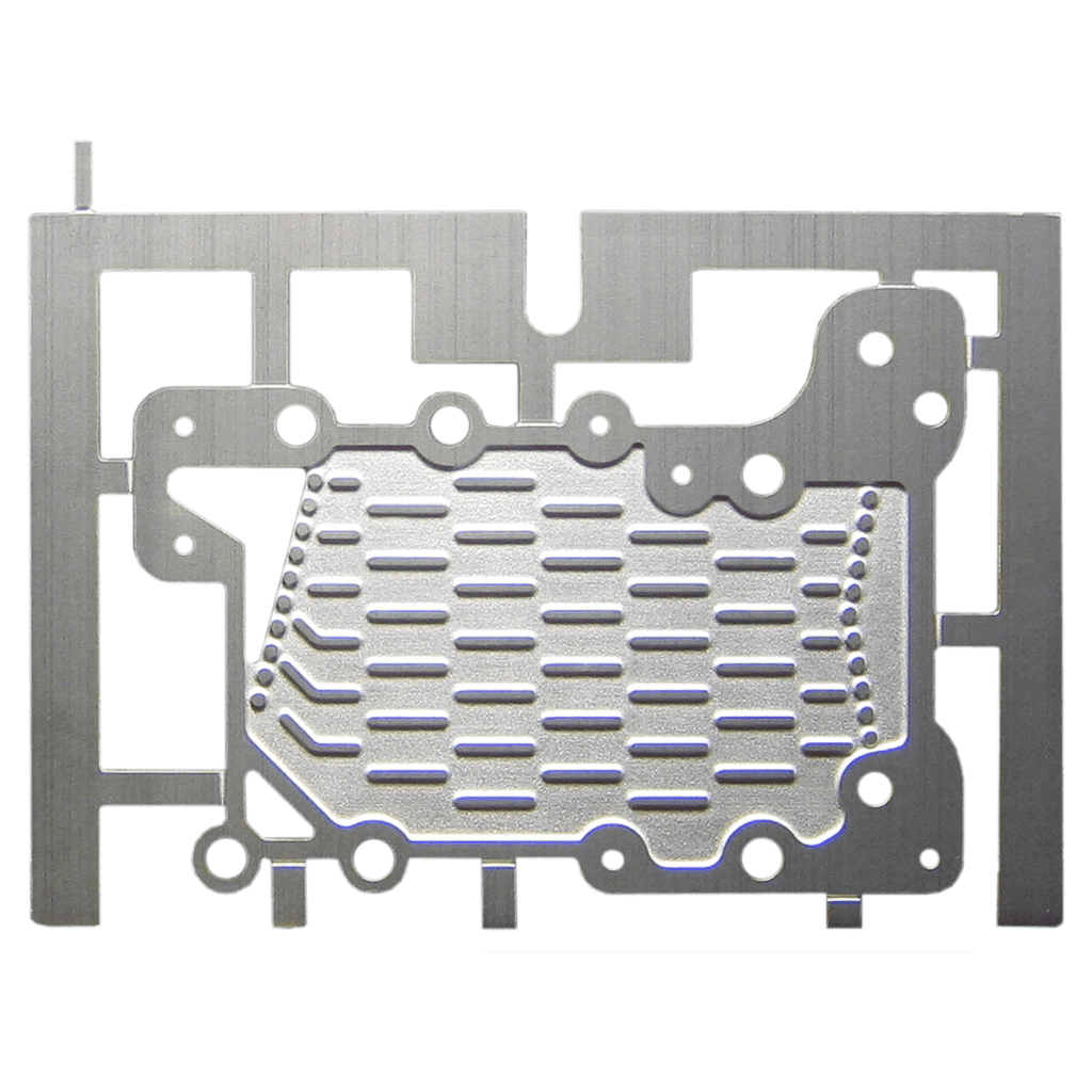 Precision-etched titanium fuel cell plate with detailed channels and cutouts.