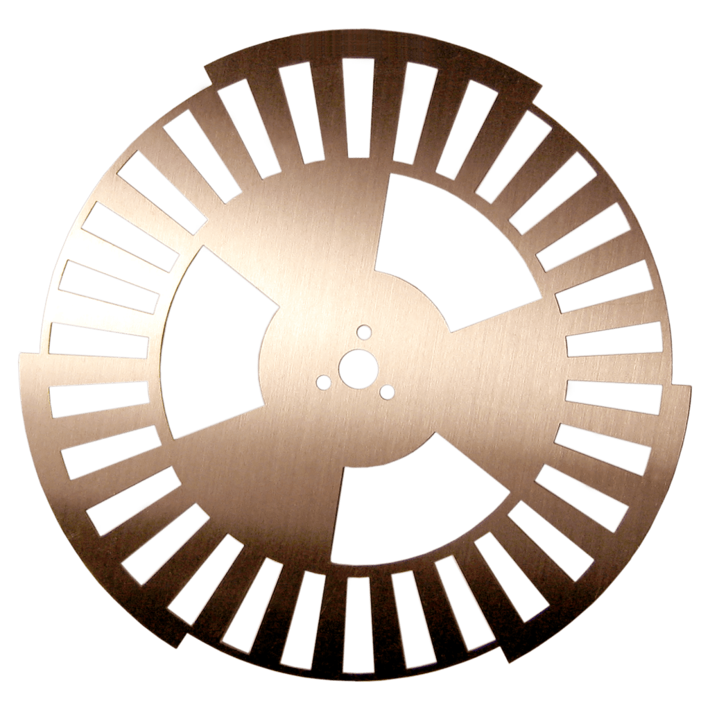 Precision-etched copper encoder disc with radial cutouts.
